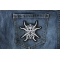 Spider Skull Iron on Patch shown on jeans