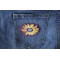 Yellow and Purple Flower Patch Yellow and Purple Flower Iron on Patch shown on jeans