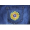 Yellow Blue Pink Flower Patch shown on jeans