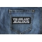 You Are Just Jealous Funny Iron on Patch shown on jeans