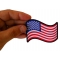 Waving US Flag Patch shown on hand for size comparison