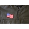 Waving US Flag Patch - 3x2.5 inch. Embroidered Iron on Patch shown on leather vest
