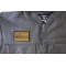 Subdued Green US Flag Patch - 3x2 inch. Embroidered Iron on Patch shown on leather vest