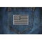 Subdued Black White US Flag Patch shown on jeans