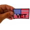 American Flag Vet Patch shown on hand for size comparison