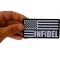 Infidel American Flag Black White Patch shown on hand for size comparison