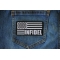Infidel American Flag Black White Patch shown on jeans