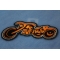 Triker Iron on Biker Patch In Orange and Black diagonal view