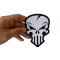 Nasty Skull Patch in White Punisher Skull Patch, Biker Skull Patches shown on hand for size comparison