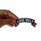 Lone Wolf Small Flag Rocker Patch Lone Wolf Patch, Biker Sayings shown on hand for size comparison