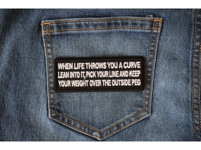 When Life throws you a curve, Lean into it, Pick your line and keep your weight over the outside Peg Patch