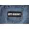Let's Misbehave Patch shown on jeans