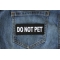 Do Not Pet Patch shown on jeans