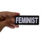 Feminist Patch shown on hand for size comparison
