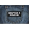 Don't Be a Douche Patch Don't Be a Douche Patch shown on jeans