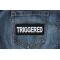 Triggered Patch Triggered Patch shown on jeans