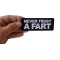 Never Trust a Fart Patch Never Trust a Fart Funny Iron on Patch shown on hand for size comparison