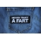 Never Trust a Fart Patch Never Trust a Fart Funny Iron on Patch shown on jeans
