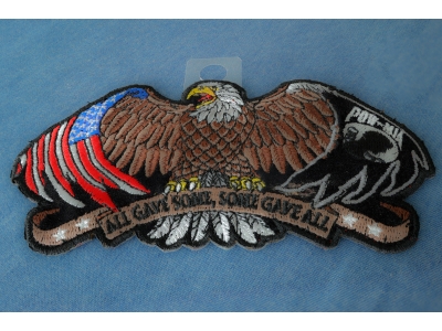 Patriotic eagle, wings spread out wide, American flag tattooed on the left, POW MIA flag on the right  