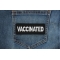 Vaccinated Patch shown on jeans