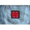 69 Patch Black Red Square 69 Patch shown on jeans