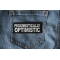 Pessimistically Optimistic Patch Pessimistically Optimistic Funny Iron on Patch shown on jeans