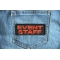 Even Staff Patch Orange Event Staff Patch Orange shown on jeans