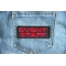 Even Staff Patch Red Event Staff Patch Red shown on jeans