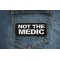 Not The Medic Patch shown on jeans