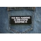 The Real Pandemic is How Stupid Everyone is Patch shown on jeans