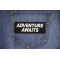 Adventure Awaits Patch shown on jeans