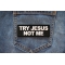 Try Jesus Not Me Patch shown on jeans