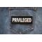 Privileged Patch shown on jeans