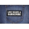 Like Share Subscribe Patch shown on jeans