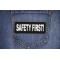 Safety First Patch shown on jeans