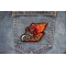 Devil Biker riding Motorcycle with Flames Patch shown on jeans