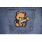 Cute Bear Machine Gun Patch shown on jeans