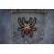 Arachnid Spider Iron on Patch shown on jeans