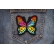 Stained Glass Butterfly Iron on Patch shown on jeans
