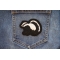 Skunk Patch shown on jeans