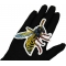 Wasp Patch shown on hand for size comparison