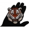 Tiger Patch shown on hand for size comparison