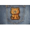 Brown Bear Patch shown on jeans