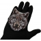 Wolf Patch shown on hand for size comparison