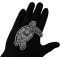 Tribal Turtle Patch shown on hand for size comparison