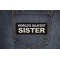 World's Okayest Sister Patch shown on jeans
