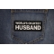 World's Okayest Husband Patch shown on jeans