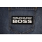 World's Okayest Boss Patch shown on jeans