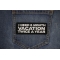 I Need a 6 month Vacation Twice a Year Patch shown on jeans