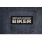 World's Okayest Biker Patch shown on jeans